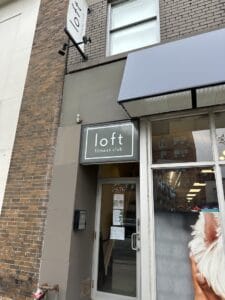 Exterior of Loft Fitness Club in Midtown Toronto Ontario with the entrance directly off Yonge Street and Briar Hill Ave.