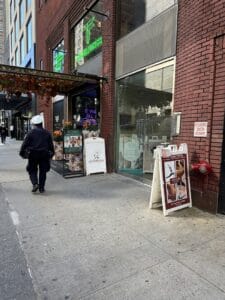 Street view of Yoga Spa Lounge 1881, highlighting the modern facade and signage.