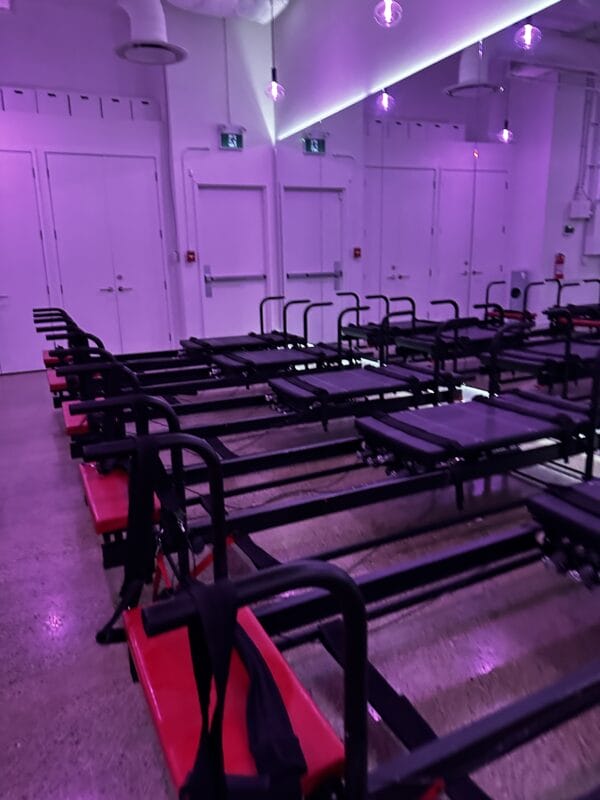 Carrie's Pilates Yorkville Toronto interior view of Yorkville Toronto, featuring reformer machines for high-intensity Pilates workouts
