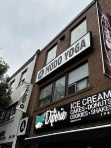 Modo Yoga Danforth Toronto studio logo and boutique storefront entrance review by Sassy Sweat